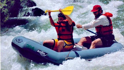 Dale Stephens and his father rafting on Cache Creek.